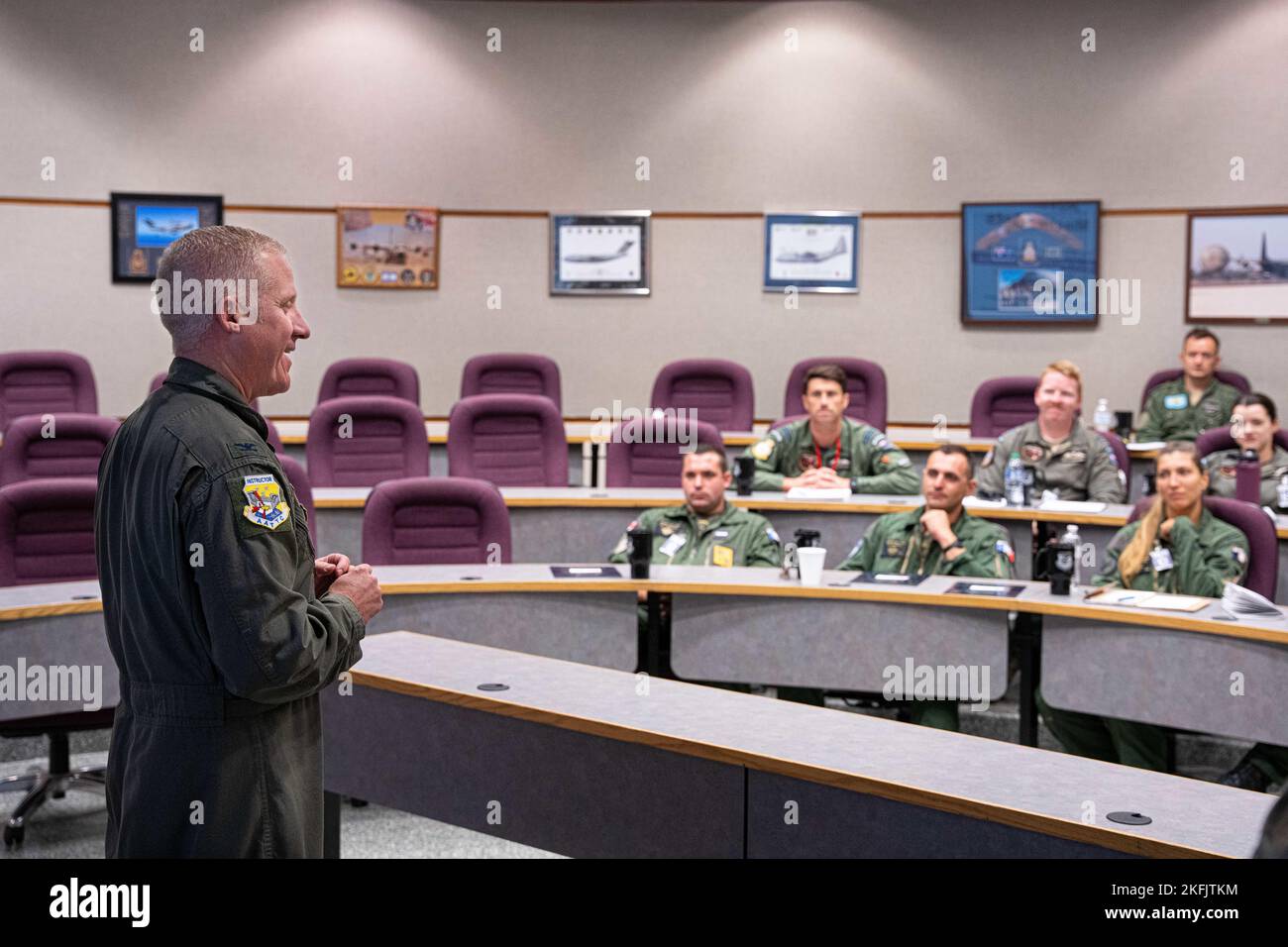 U.S. Air Force Col. Barrett Golden, commandant of the Advanced Airlift Tactics Training Center, greets students of the Advanced Tactics Aircrew Course during a welcome brief at Rosecrans Air National Guard Base, in St. Joseph, Missouri, September 19, 2022. This class was composed of entirely international aircrews from the Royal New Zealand Air Force, Royal Danish Air Force, and for the first time an aircrew from the French Air Force. Since 1983 the training center has provided advanced tactical training to airlift aircrews from the Air National Guard, Air Force Reserve Command, Air Mobility C Stock Photo