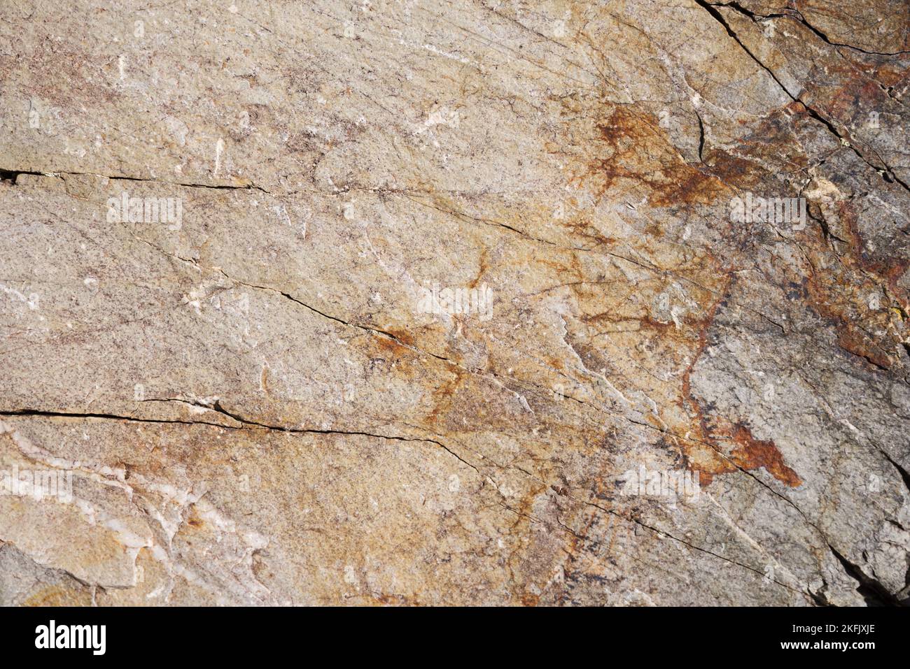 tan and gray quartzite rock background texture with cracks Stock Photo