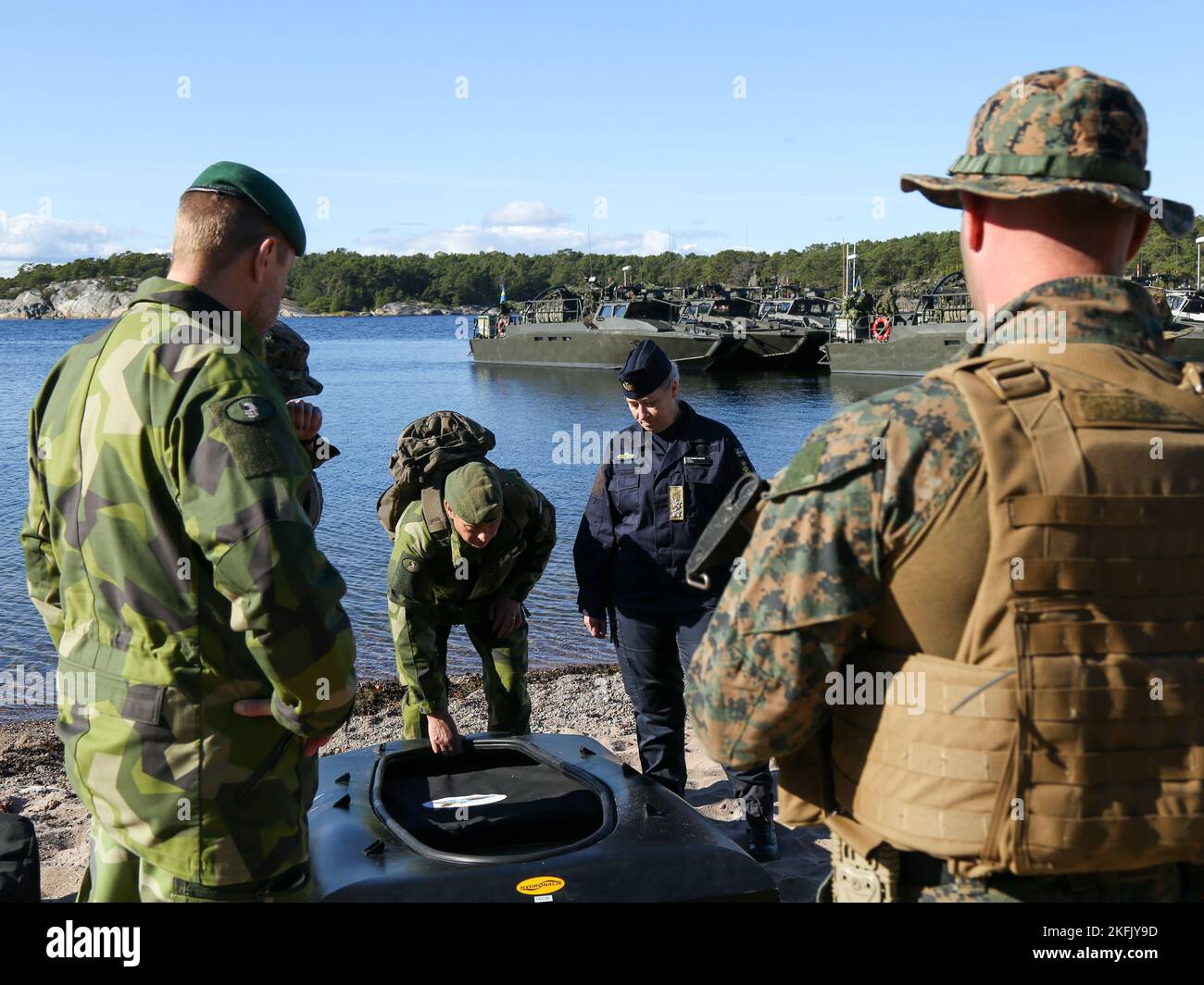 Swedish Navy Rear Admiral Ewa Skoog Haslum (right), Chief of Swedish Navy, and Swedish Marine leadership, receive a demonstration on how unmanned surface vehicles are used in support of expeditionary advanced base operations, while visiting U.S. and Swedish Marines during exercise Archipelago Endeavor 22 (AE22) on Berga Naval Base, Sweden, Sept. 21, 2022. AE22 is an integrated field training exercise that increases operational capability and enhances strategic cooperation between the U.S. Marines and Swedish forces. Stock Photo