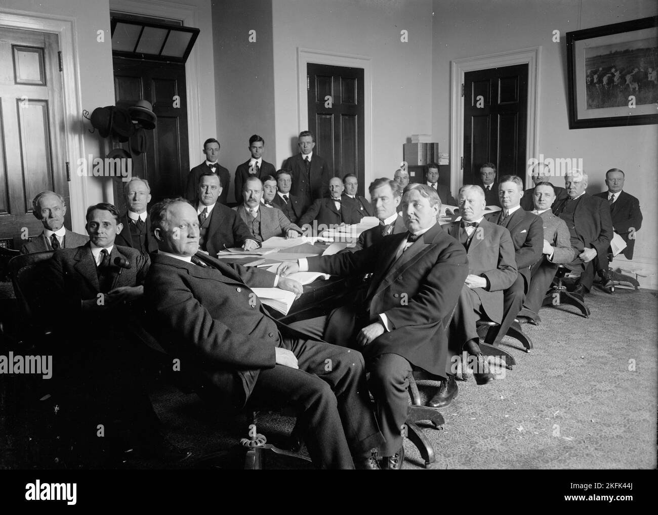 House of Representatives Committees - Agriculture. in Front of Table: Reps. Lever of Sc, Chairman; Gordon Lee of Ga; Young of Tx; Heflin of Al; Lesher of Pa; Doolittle of Ks; Unidentified; Haugen of Ia; Unidentified. at Rear of Table: Candler of Ms; Extra Left; Rubey of Mo; Jacoway of Ar.; M.K. Reilly of Wi, 1914 or 1916. Stock Photo