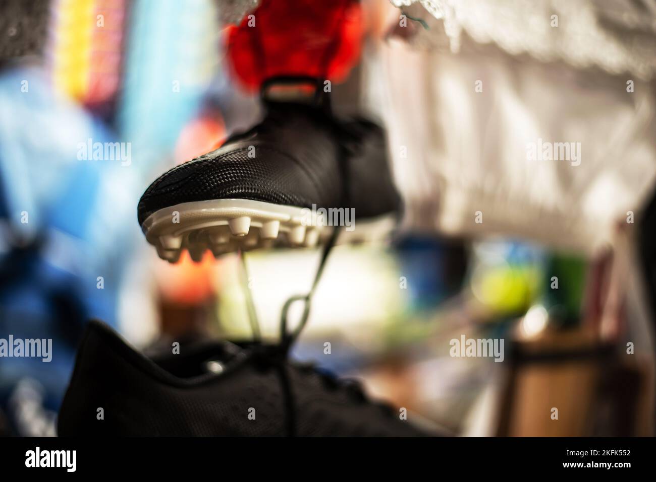 Soccer Cleats are hanging intron of a retail store Stock Photo
