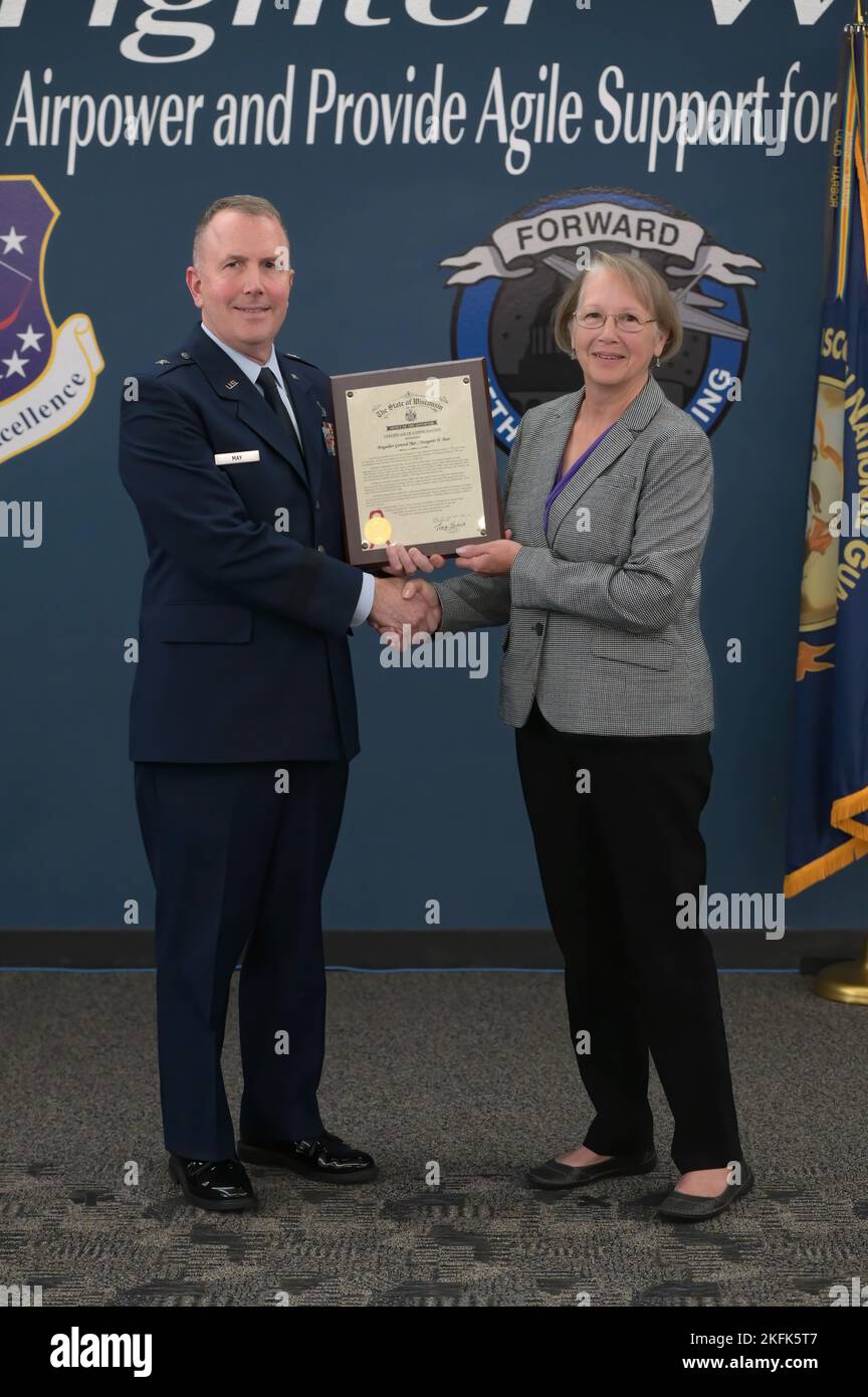U.S. Air Force Brig. Gen. David May, the Wisconsin National Guard's deputy adjutant general for Air, inducts retired U.S Air Force Brig. Gen. Margaret Bair into the Wisconsin Air National Guard Hall of Fame during a ceremony at Truax Field in Madison, Wisconsin, Sept. 22, 2022. Bair began her military career in 1976 as an active-duty Air Force nurse, transitioning into the Montana Air National Guard in 1986, and Wisconsin ANG in 1994. During her career she served as the 128th Medical Group commander in Milwaukee, and Wisconsin ANG chief of staff, becoming the first female general officer in th Stock Photo
