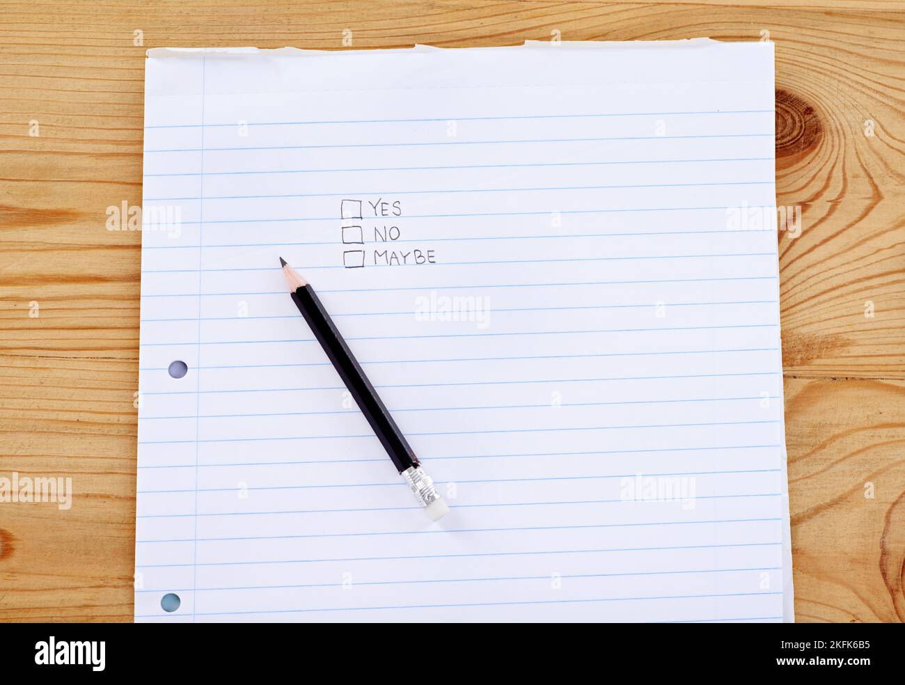 What will it be. A writing pad with the words yes, no and maybe in check boxes. Stock Photo