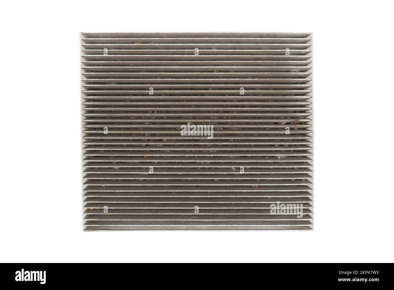 Used car cabin charcoal air filter isolated on white background. Dirty