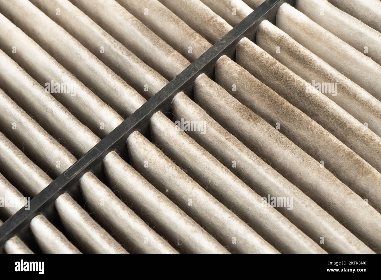 Used car cabin charcoal air filter texture background. Dirty carbon car