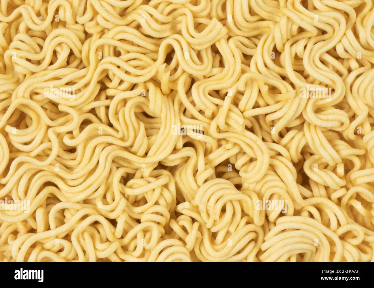 Macro shot texture of dry instant noodles. Raw dried Instant ramen noodles  texture background Stock Photo - Alamy