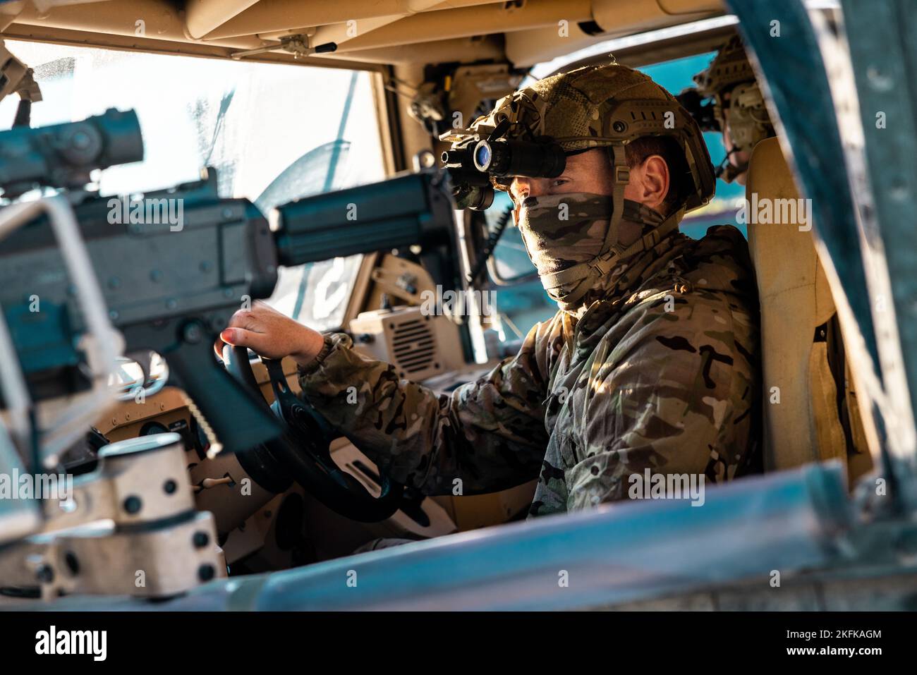 A United Kingdom Royal Marine from 45 Commando sits behind the wheel of an M1288 GMV 1.1 light utility vehicle while conducting training mission rehearsals at Grafenwöhr Training Area, Germany, Sept. 22, 2022. This Special Forces-led exercise is designed to improve their ability to work with the United Kingdom’s commando forces in a time of crisis. Stock Photo