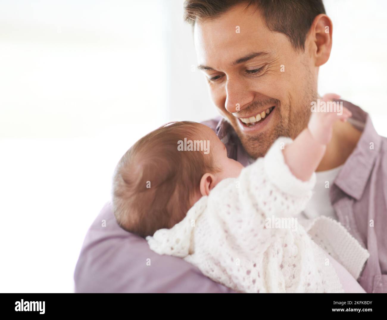 Dad and his daughter. a young father holding his adorable baby girl ...