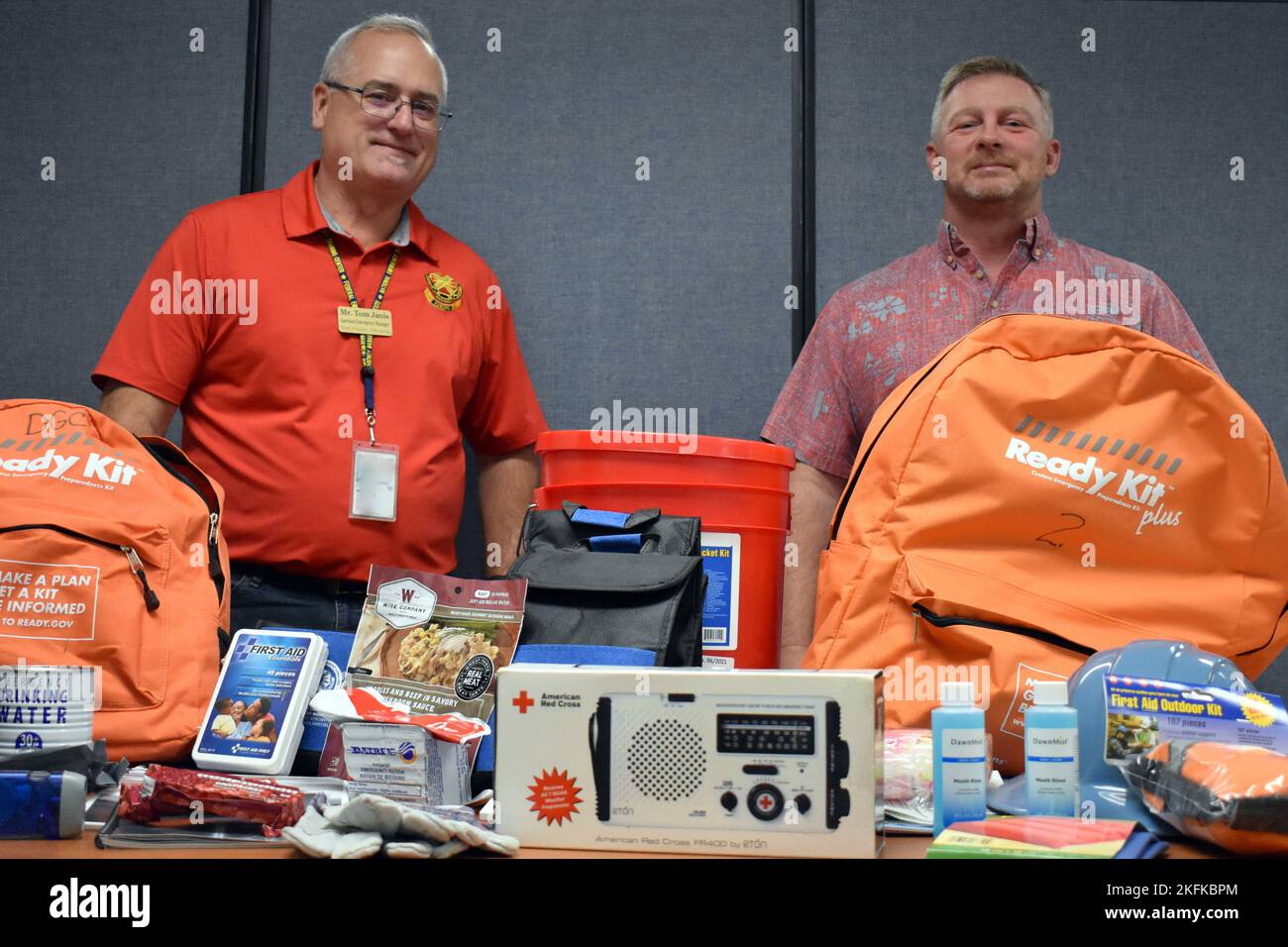 Tom Janis, left, emergency manager for U.S. Army Garrison Presidio of Monterey, and Tom Davis, USAG PoM antiterrorism officer, display examples of items they hope community members will keep on hand in case of emergency. Stock Photo
