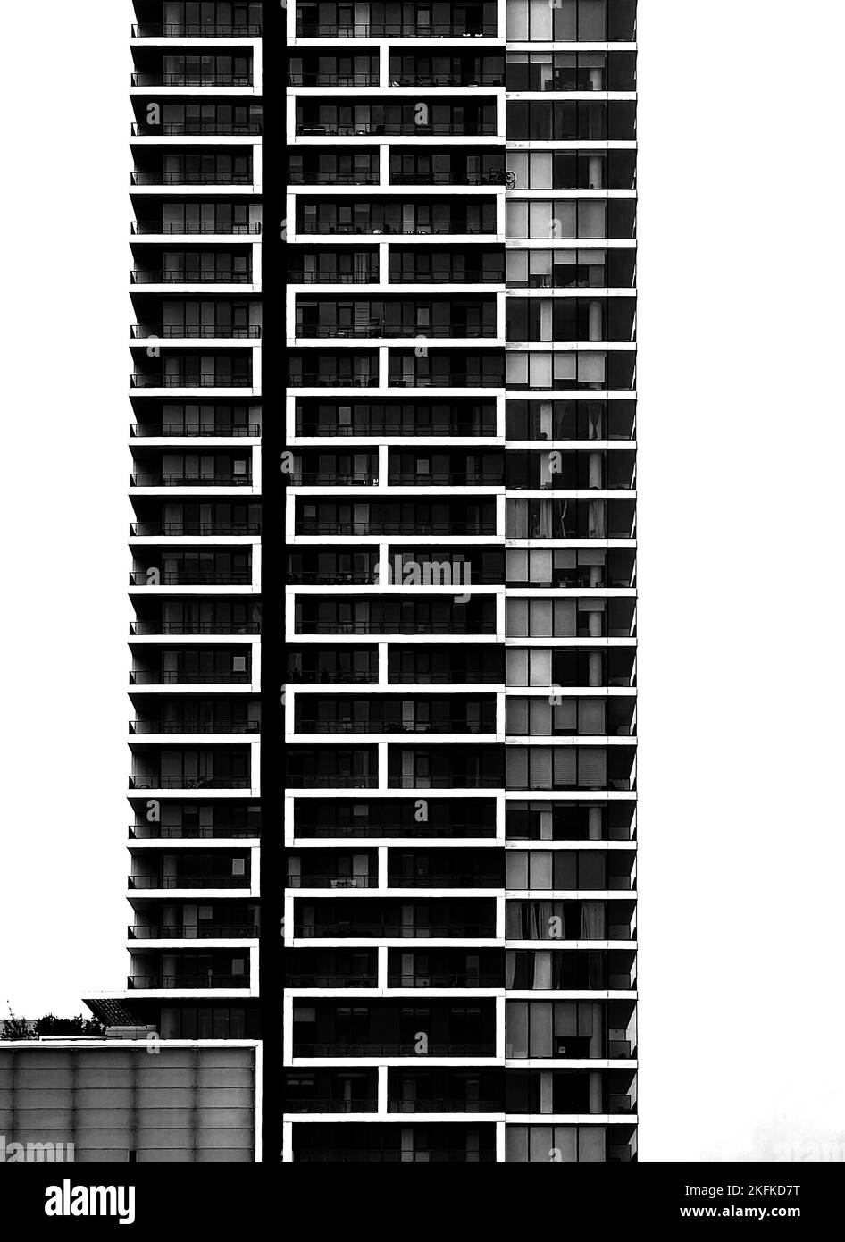 A vertical blackandwhite shot of a residential building block