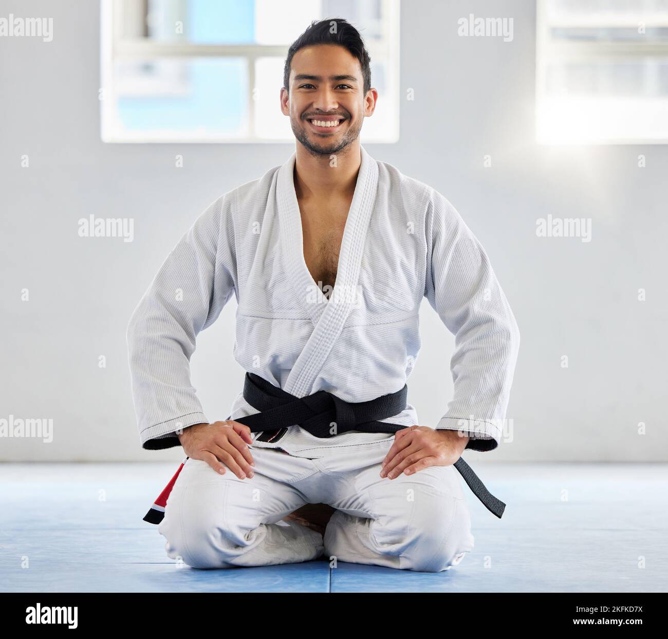 Karate, fitness and athlete, man with black belt and martial arts portrait, training and discipline with exercise. Taekwondo, combat sport and active Stock Photo