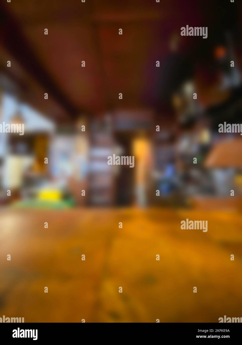 defocused on purpose. Wood table Bar counter in dark night cafe