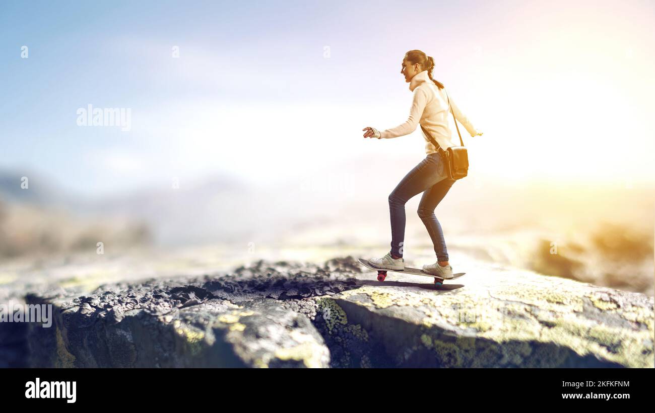 Young woman riding her skateboard Stock Photo
