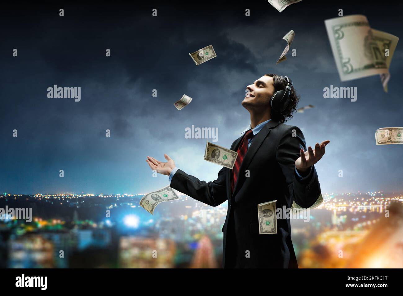 Young businessman with headphones . Mixed media Stock Photo