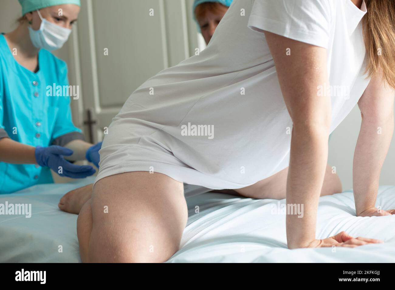 Child birth process, helping personal during labour Stock Photo
