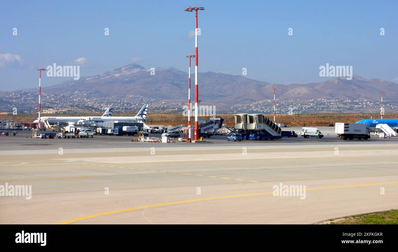 Airfield with planes and equipment of the Athens International Airport, mountainous landscape in the background, Athens, Greece Stock Photo