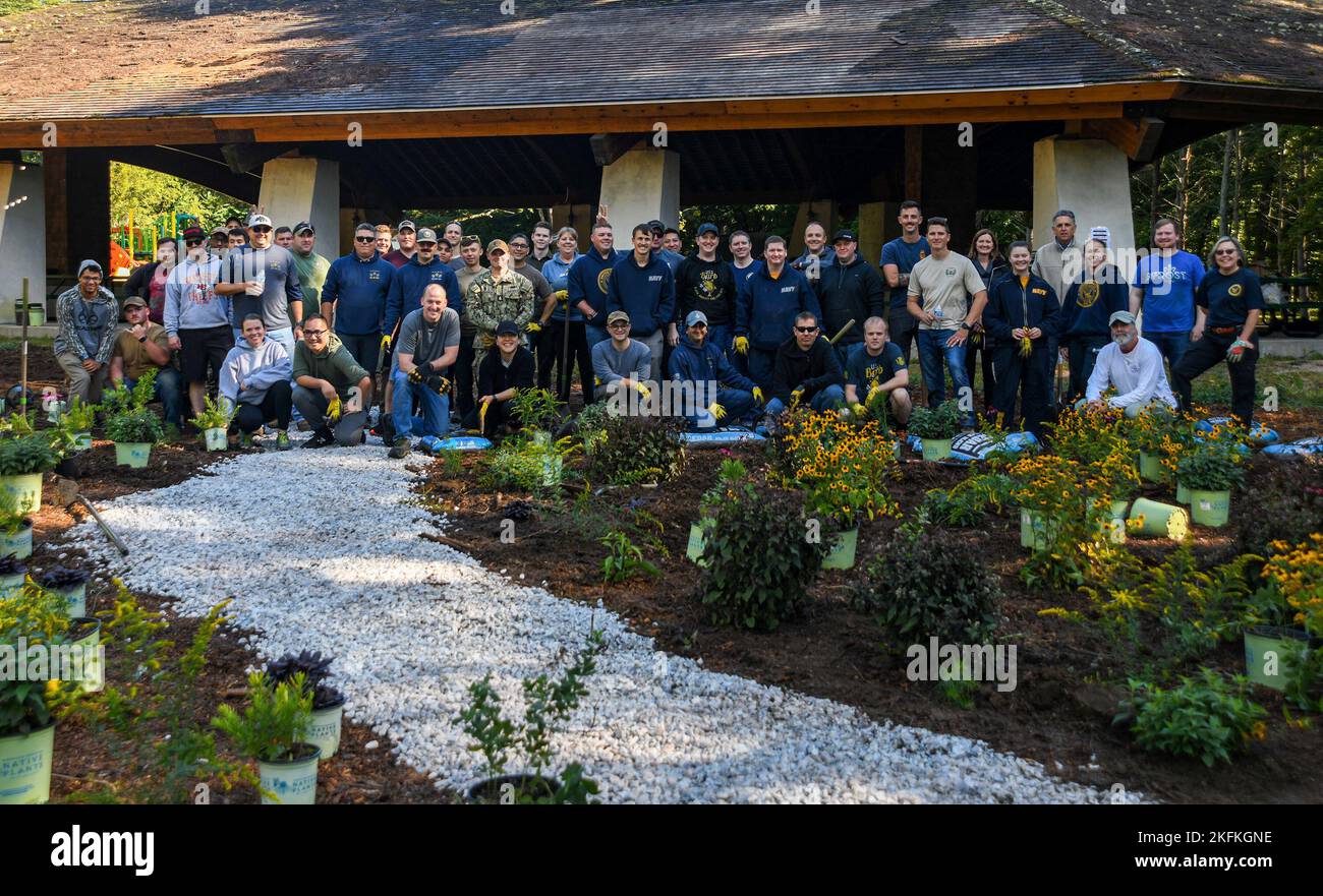 220923-N-MQ631-1109 GROTON, Conn. (September 23, 2022) - Submarine Base New London (SUBASE) personnel posed for a group photo while teaming up with the National Environmental Education Foundation in the planting of a pollinator garden within the Admiral Fife Recreation park in Stonington, Connecticut in honor of National Public Lands Day, September 24, 2022.  Established in 1994 and held annually on the fourth Saturday of, National Public Lands Day is traditionally the nation’s largest single-day volunteer effort. It celebrates the connection between people and green space in their community, Stock Photo