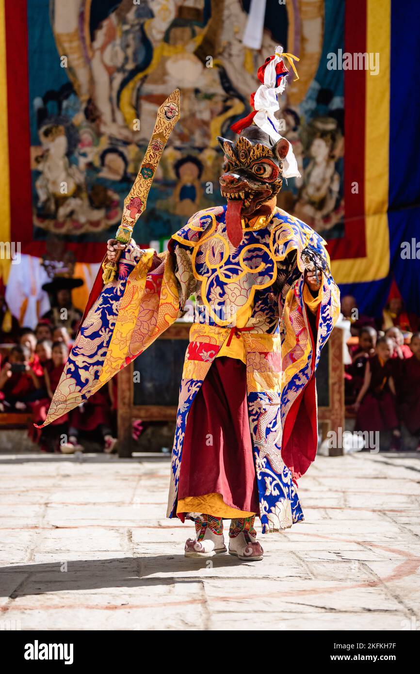 A Tibetan Buddhist dancer in traditional demon spirit ghost clothing in ...