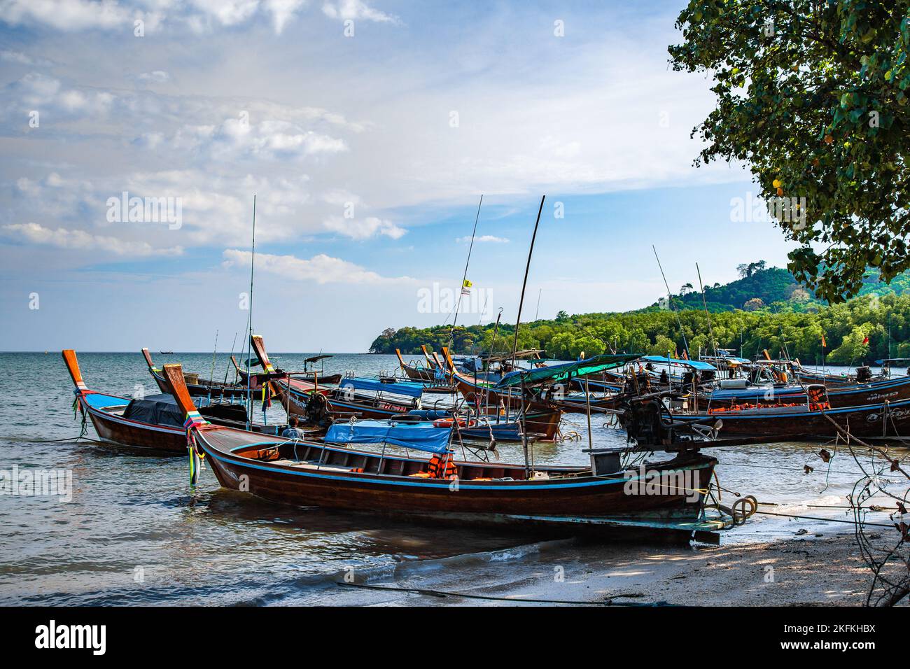 Beach view with long tail boats in koh Mook or koh Muk island, in Trang, Thailand Stock Photo