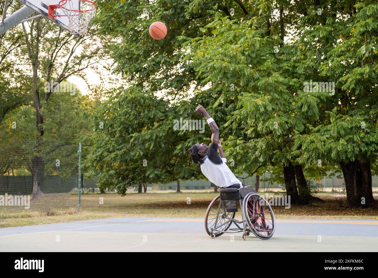 African american basketball player in action, wheelchair athlete going