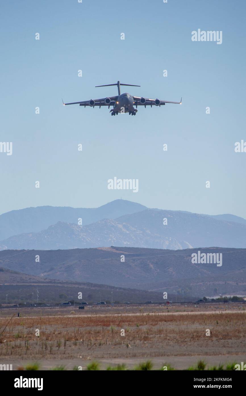 A U.S. Air Force C-17 Globemaster III with the C-17 West Coast Demo Team conducts an aerial demonstration during the 2022 Marine Corps Air Station Miramar Air Show at MCAS Miramar, San Diego, California, Sept. 24, 2022. The C-17 Demo Team, stationed at Joint Base Lewis-McChord, Washington, was established in 2019 and participates in air shows across the United States to showcase the capabilities of the C-17 and represent the Air Force through community outreach. The theme for the 2022 MCAS Miramar Air Show, “Marines Fight, Evolve and Win,” reflects the Marine Corps’ ongoing modernization effor Stock Photo