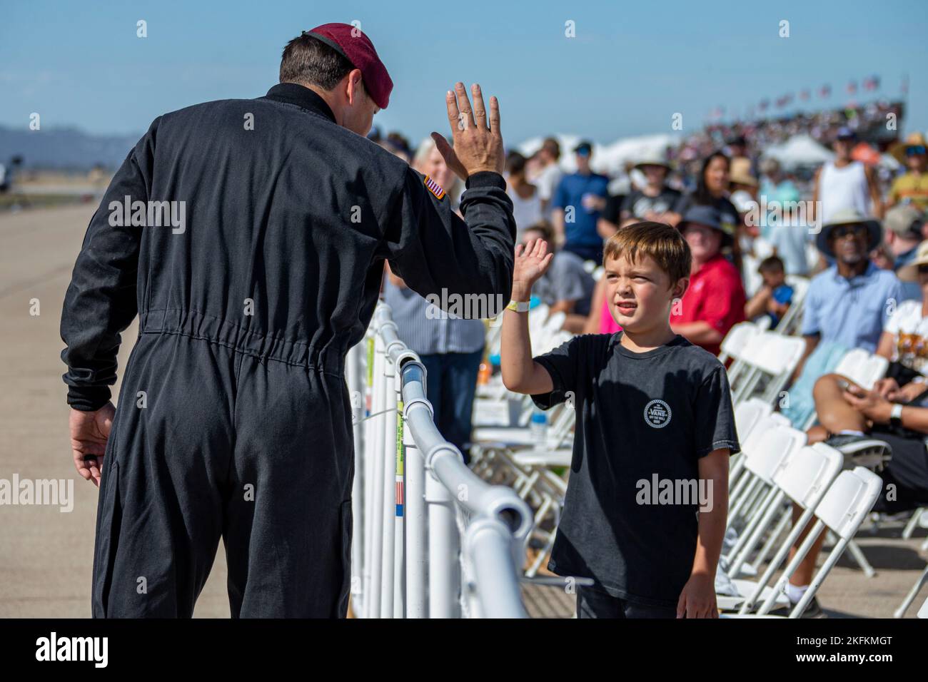 The U.S. Army Parachute Team high fives members of the crowd at the 2022 Marine Corps Air Station Miramar Air Show at MCAS Miramar, California, Sept. 24, 2022. Nicknamed the Golden Knights in 1962, “Golden” signifies the gold medals the team won in international competitions, and “Knights” alludes to the team’s ambition to conquer the skies. The Golden Knights perform in more than 100 events per year.  The theme for the 2022 MCAS Miramar Air Show, “Marines Fight, Evolve and Win,” reflects the Marine Corps’ ongoing modernization efforts to prepare for future conflicts. Stock Photo