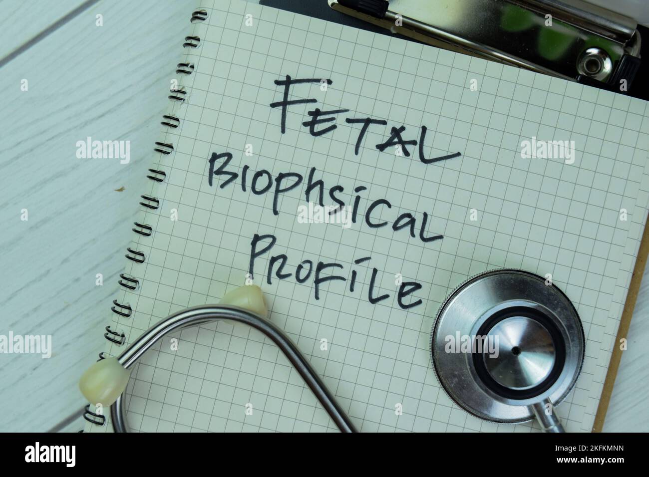 Concept of Fetal Biophsical Profile write on a book isolated on Wooden Table. Stock Photo