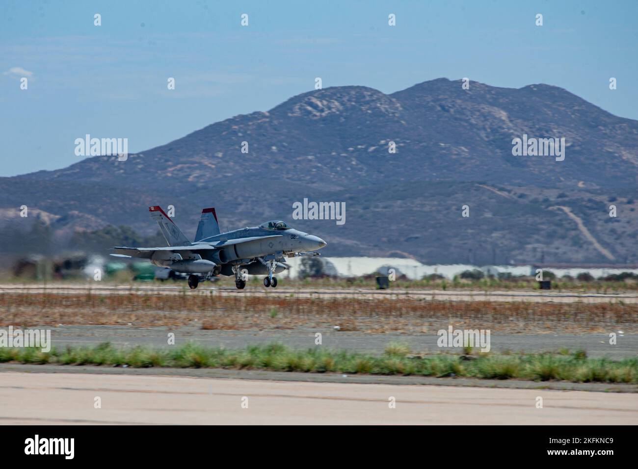 An F/A-18 Hornet takes off during the Marine Air-Ground Task Force demonstration of the 2022 Marine Corps Air Station Miramar Air Show at MCAS Miramar, San Diego, California, Sept. 24, 2022. The MAGTF Demo displays the coordinated use of close-air support, artillery and infantry forces, and provides a visual representation of how the Marine Corps operates. The theme for the 2022 MCAS Miramar Air Show, “Marines Fight, Evolve and Win,” reflects the Marine Corps’ ongoing modernization efforts to prepare for future conflicts. Stock Photo