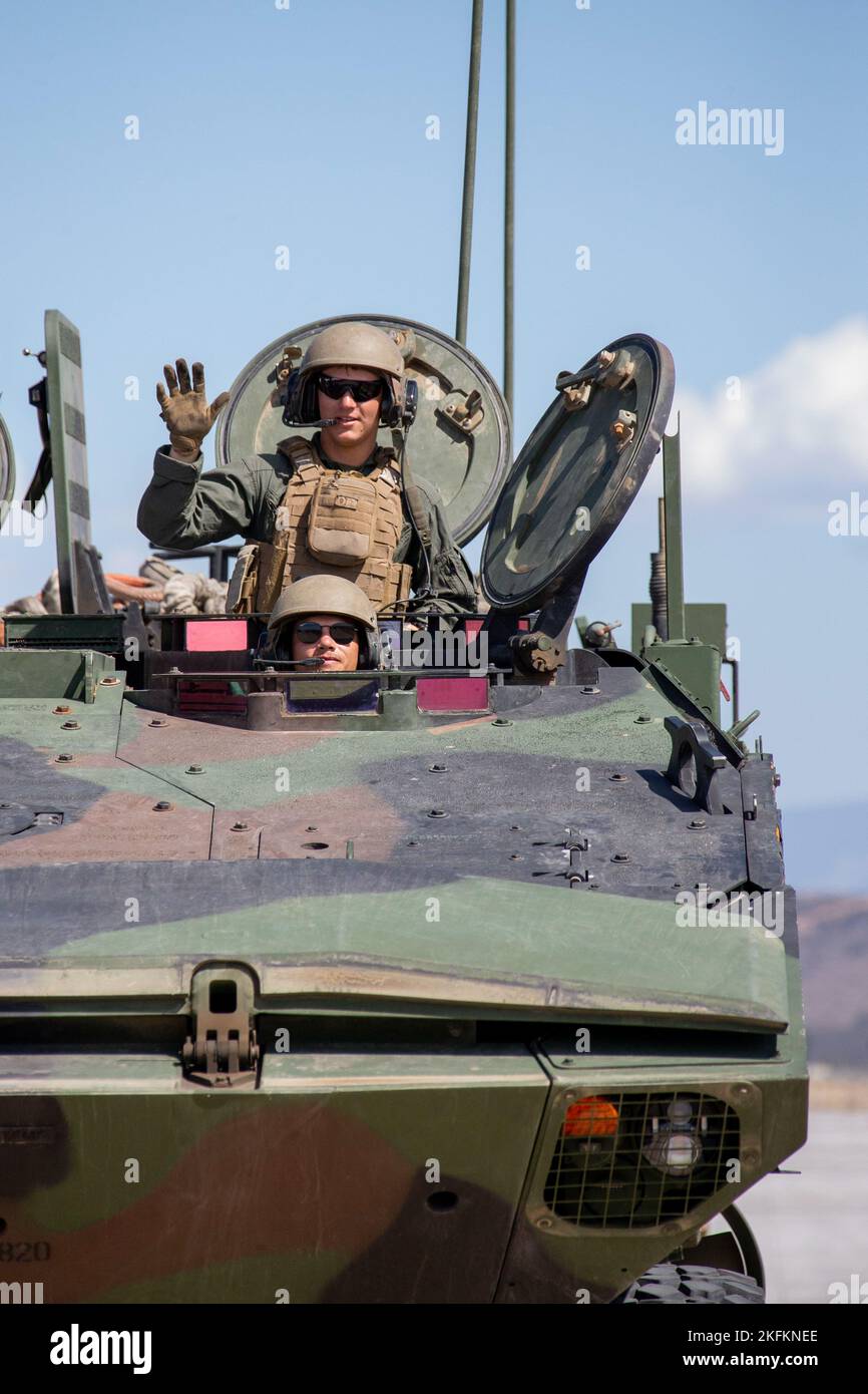U.S. Marines with 3d Assault Amphibian Battalion, 1st Marine Division, pose for a photo while driving an Amphibious Combat Vehicle after the Marine Air-Ground Task Force demonstration of the 2022 Marine Corps Air Station Miramar Air Show at MCAS Miramar, San Diego, California, Sept. 24, 2022. The MAGTF Demo displays the coordinated use of close-air support, artillery and infantry forces, and provides a visual representation of how the Marine Corps operates. The theme for the 2022 MCAS Miramar Air Show, “Marines Fight, Evolve and Win,” reflects the Marine Corps’ ongoing modernization efforts to Stock Photo