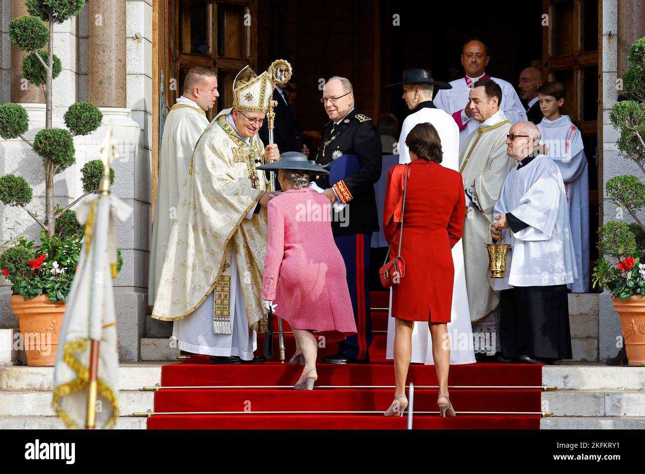 Archbishop of Monaco Dominique-Marie David welcomes Prince Albert II of Monaco, Princess Charlene, Princess Caroline of Hanover and Princess Stephanie as they arrive to attend a mass at Monaco Cathedral during the celebrations marking Monaco's National Day, November 19, 2022. REUTERS/Eric Gaillard Stock Photo