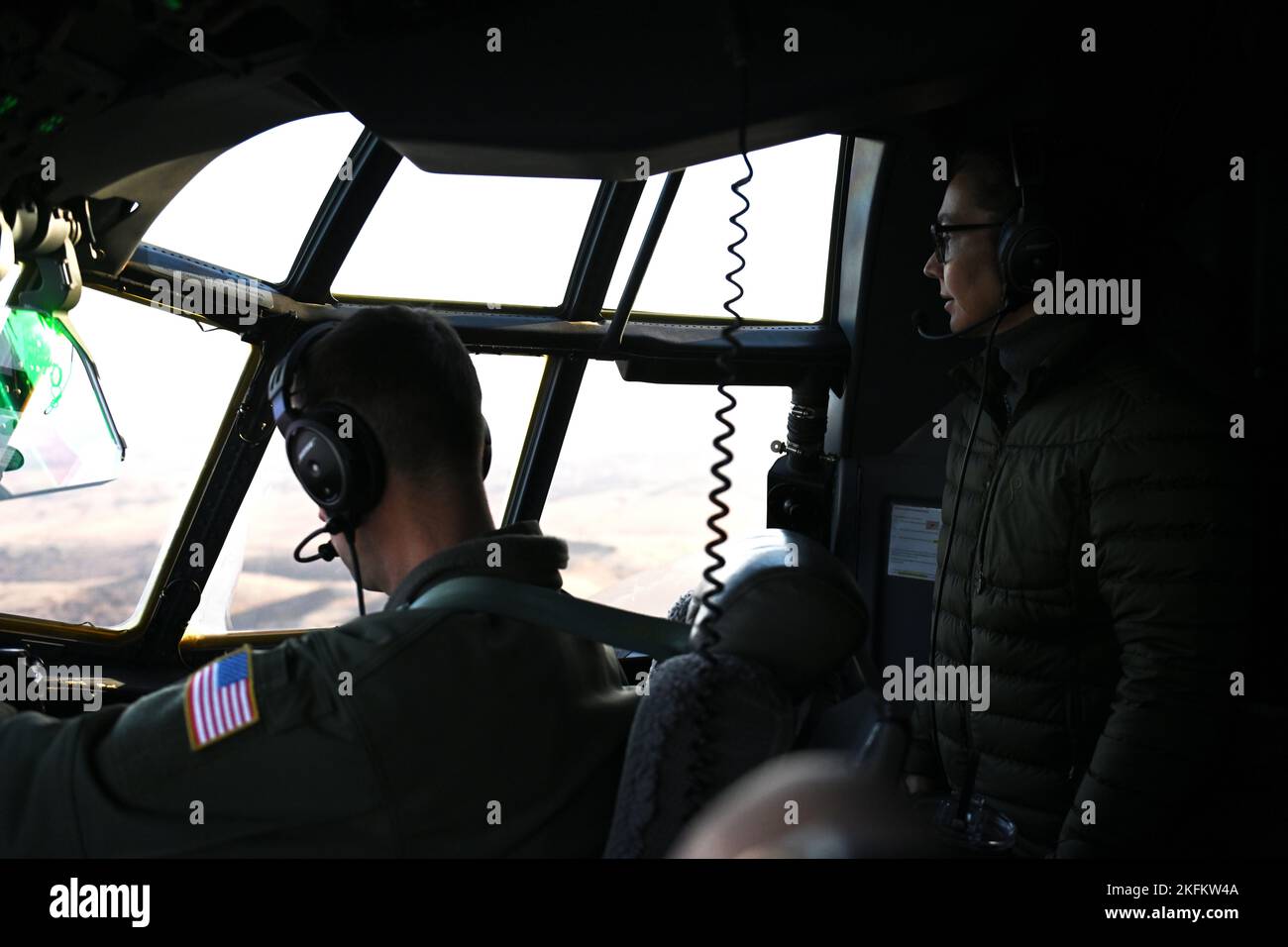 U.S. Rep. Mary Peltola, representative of Alaska, looks out of the cockpit window of a Coast Guard C-130 Hercules airplane from Air Station Kodiak, Sept. 24, 2022. Rep. Peltola worked with the Coast Guard to assess damage to Western Alaskan villages and communities caused by Typhoon Merbok. U.S. Coast Guard photo by Petty Officer 3rd Class Ian Gray. Stock Photo