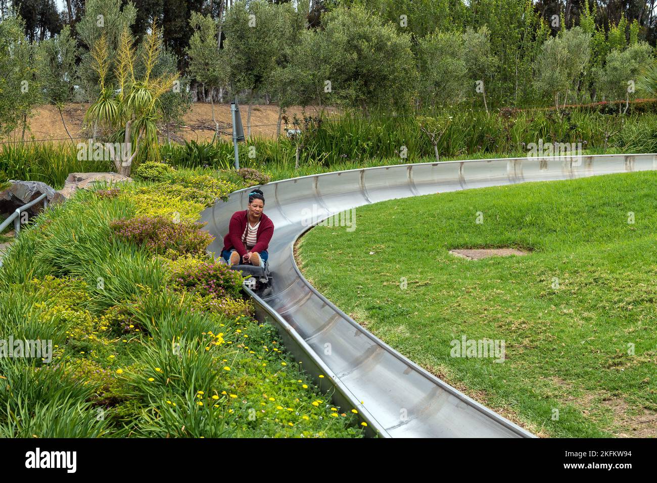 Bellville, South Africa - Sep 17, 2022: Tobogganing at Cool Runnings in Bellville in the Western Cape Province. A person is visible Stock Photo