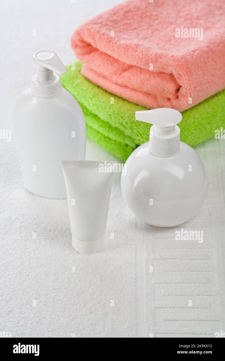 Accessories for bathing on white towel Stock Photo - Alamy