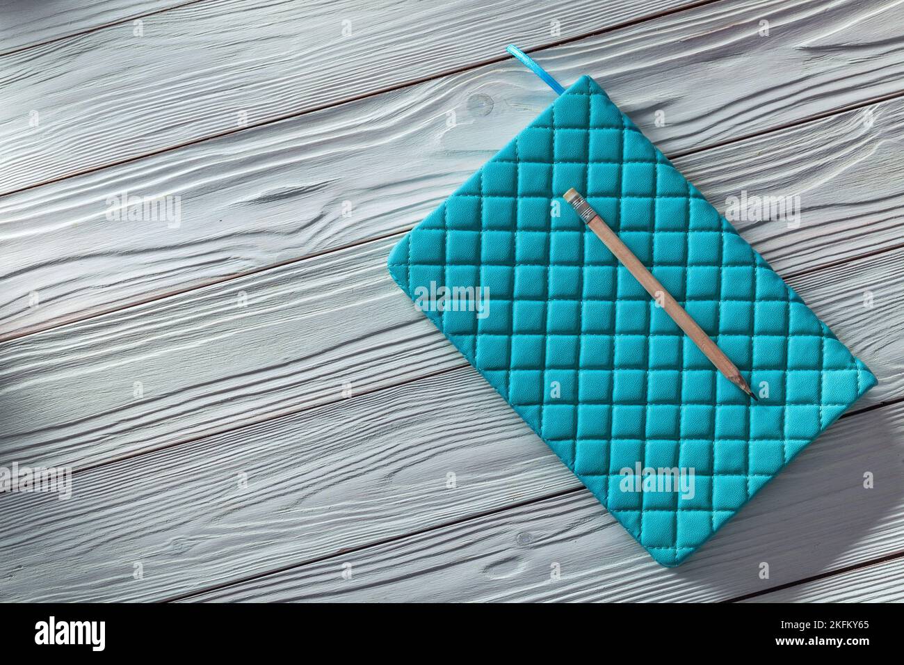 blue notepad with classic pencil on white vintage wooden boards Stock ...