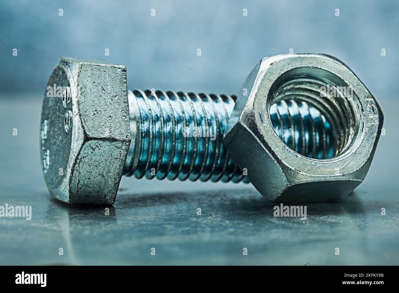 bolt and nut on metalic background Stock Photo