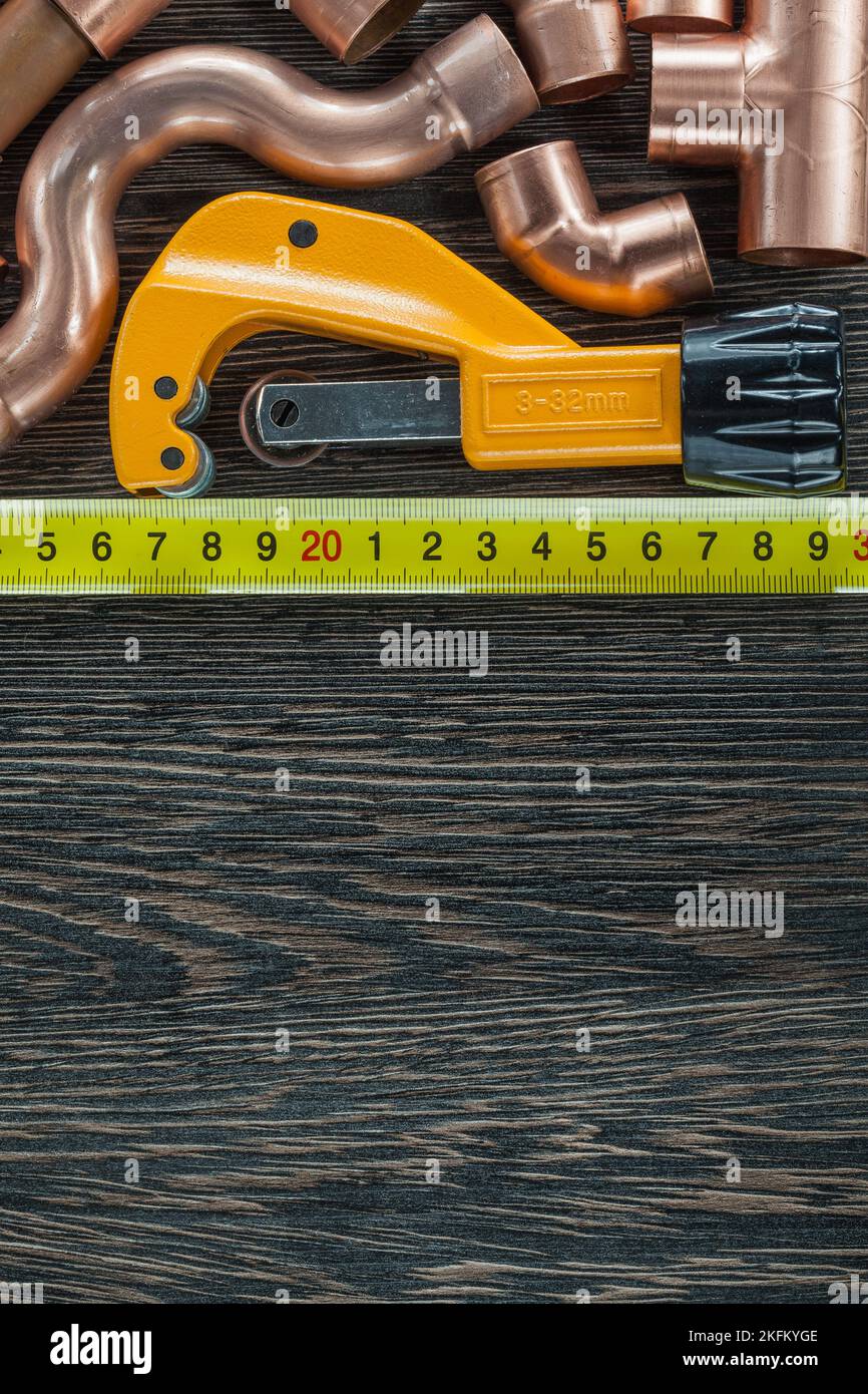 Brass water pipes tape measure pipe scissors Stock Photo Alamy