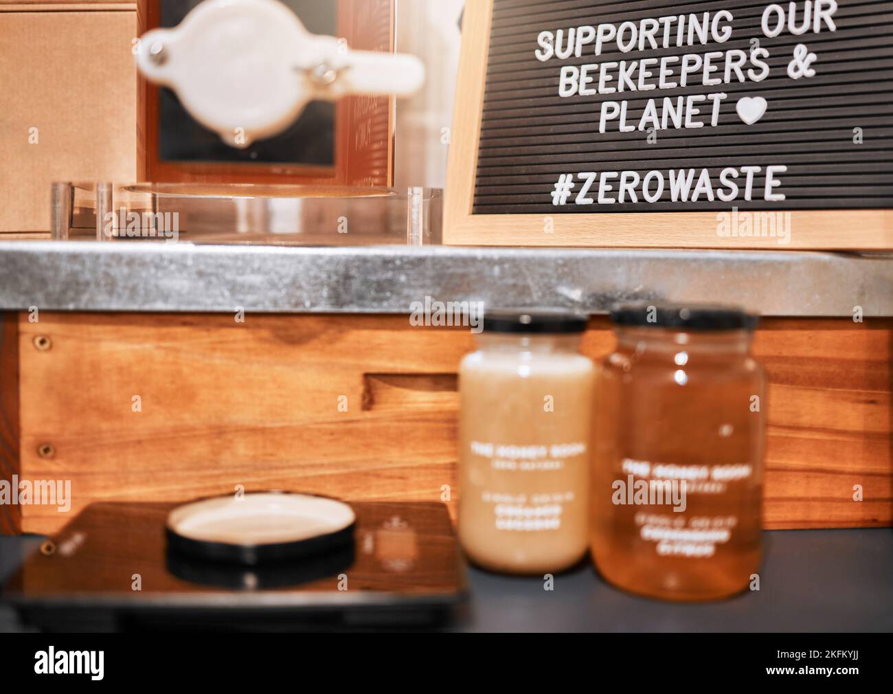 Honey, jar and small business retail or sale market, supermarket and honey jars on counter. Raw