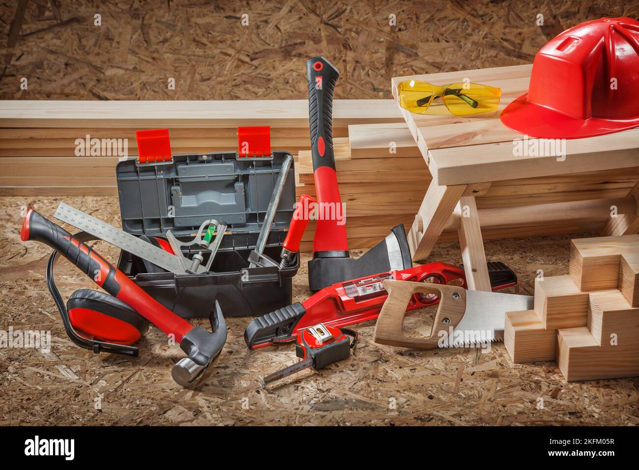 Red Carpenters Tools Set On Construction Site. Plywood Background Stock