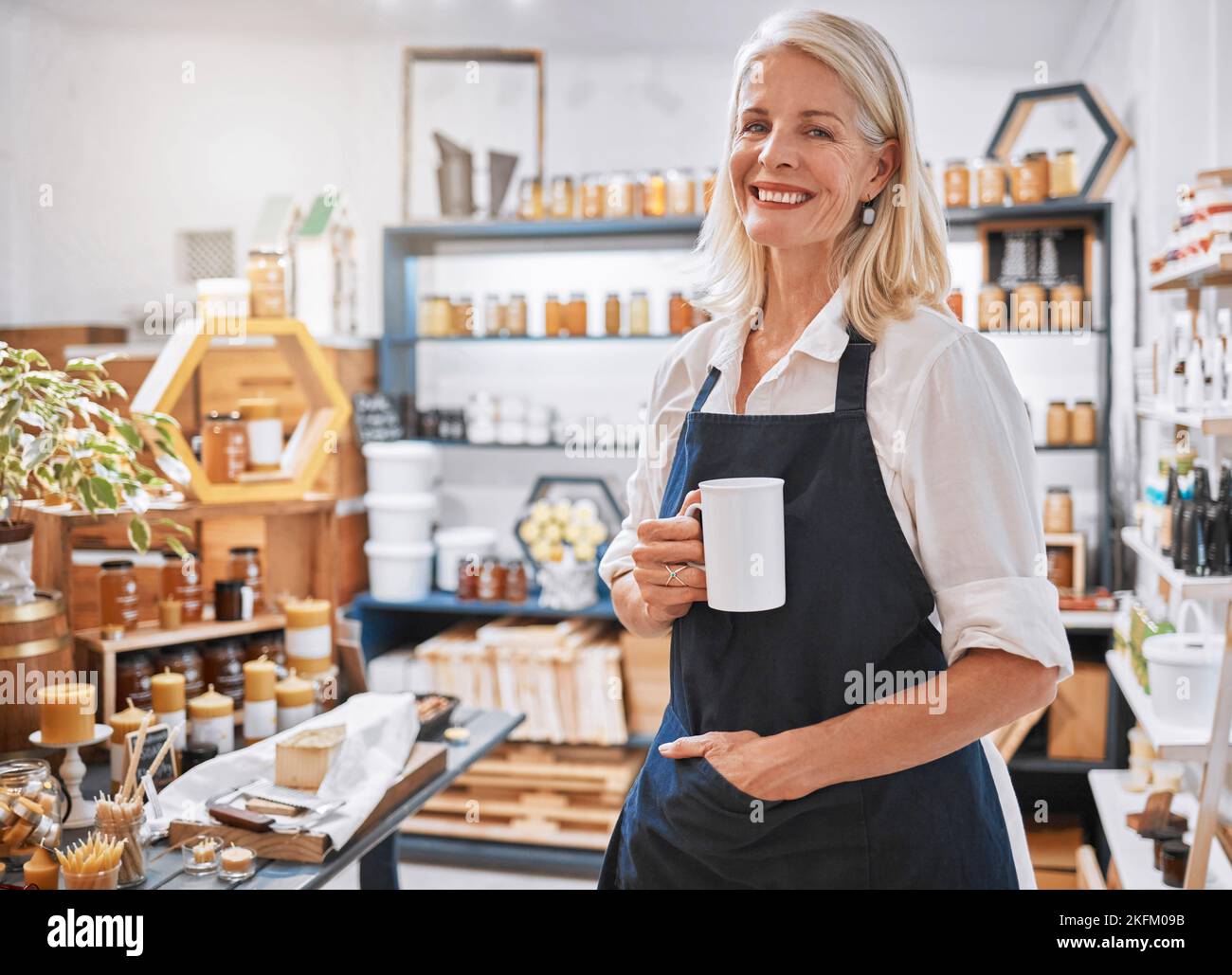 Coffee, portrait and senior small business entrepreneur standing in her