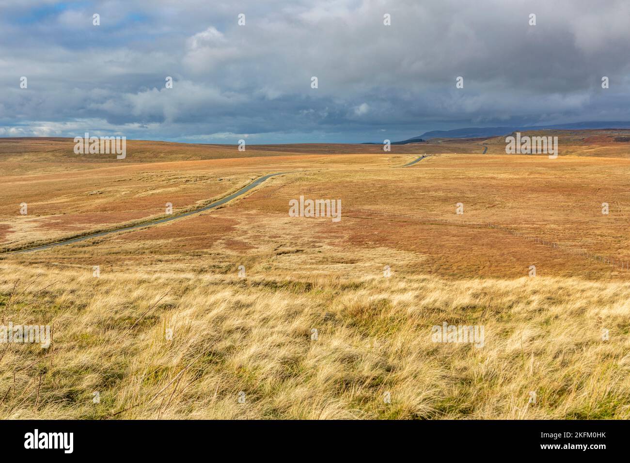 The Pennine Way Long Causeway winding across the North Yorkshire Dales from Tan Hill Stock Photo