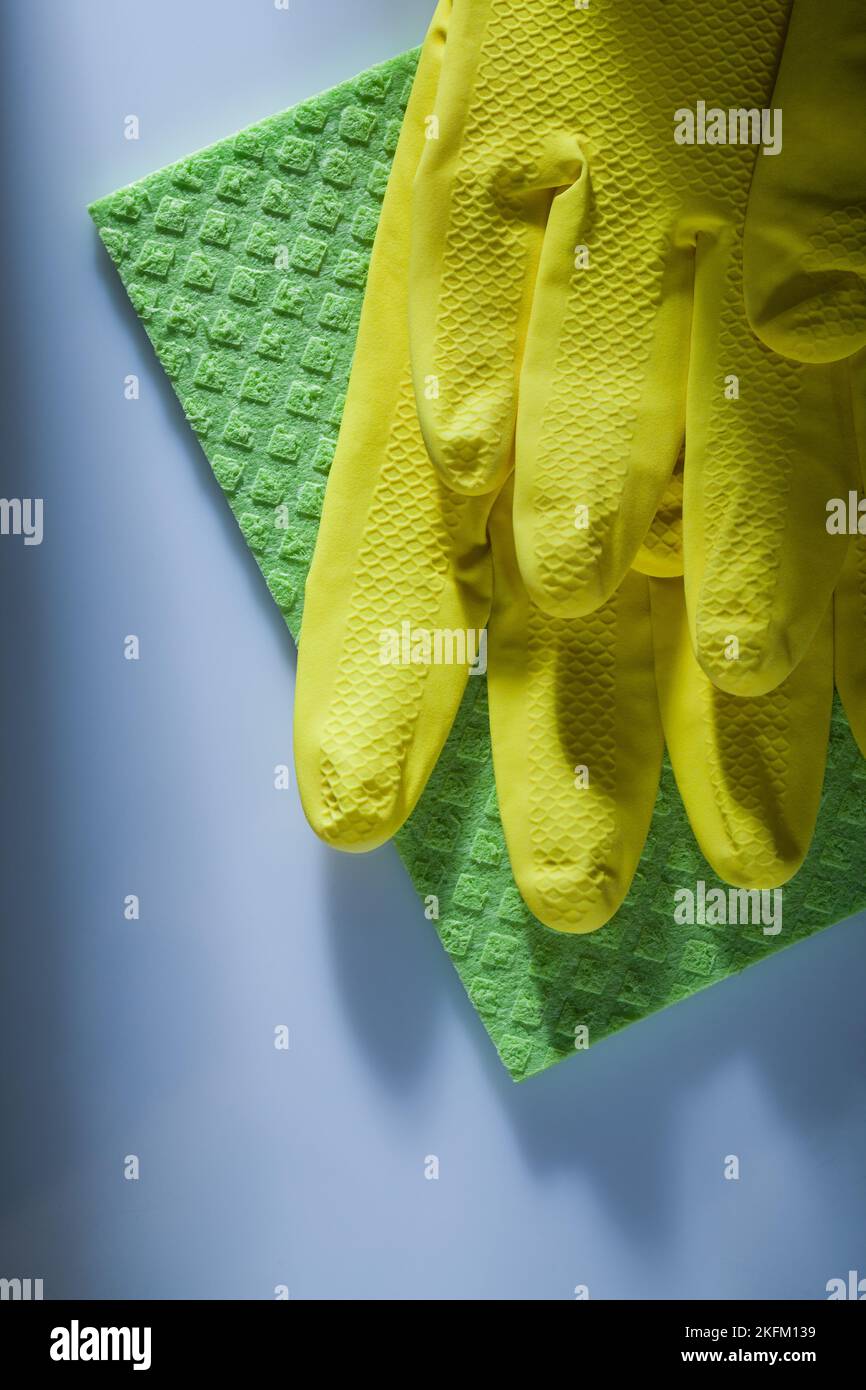 Cleaning washcloth safety gloves on white surface. Stock Photo