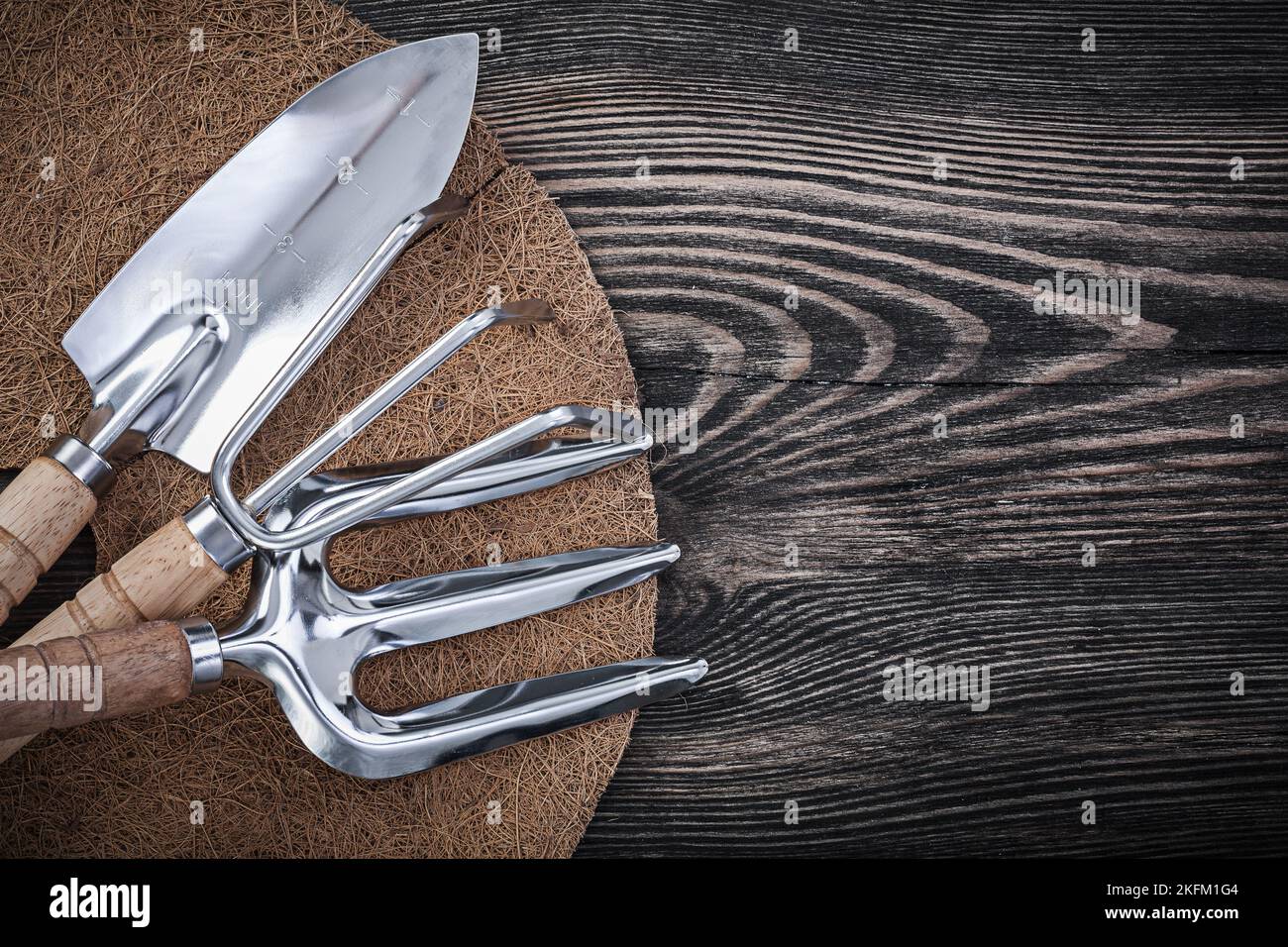Coir fiber mulch mat rake trowel fork shovel on wooden board agriculture concept Stock Photo Alamy