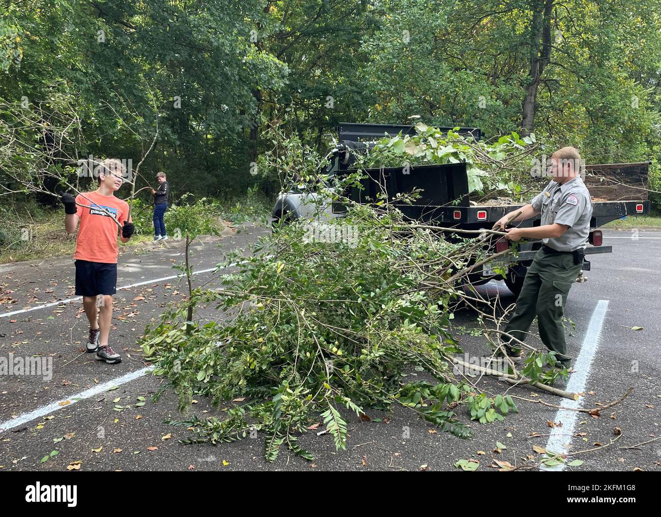 Local volunteers trimmed bushes and trees at Stark Knob Boat Ramp during National Public Lands Day at Old Hickory Lake in Hendersonville, Tennessee. Park Ranger Jakob Craig loaded brush onto a truck that took the trimmings to be properly disposed of. Stock Photo