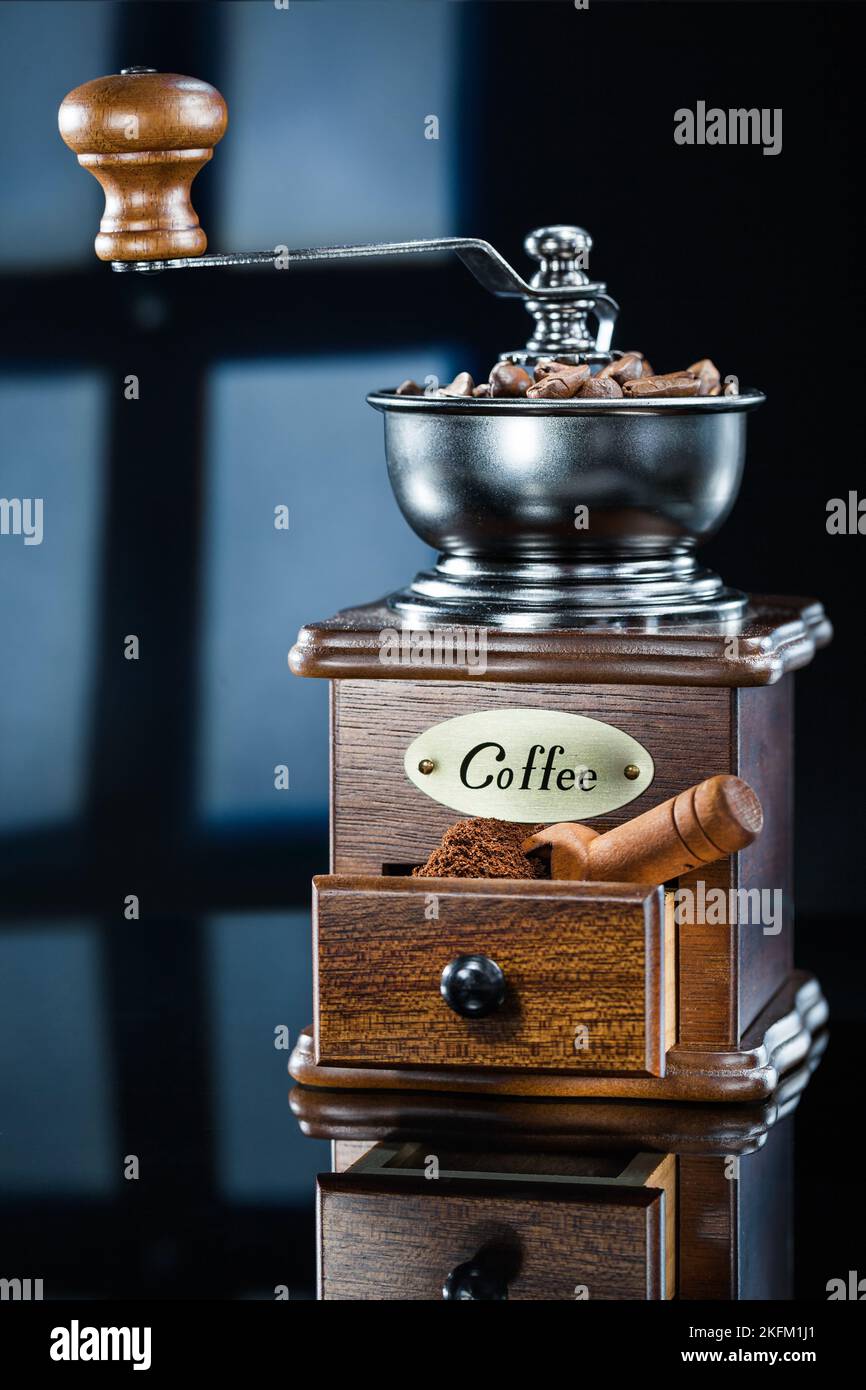 coffee mill with beans on abstract background Stock Photo