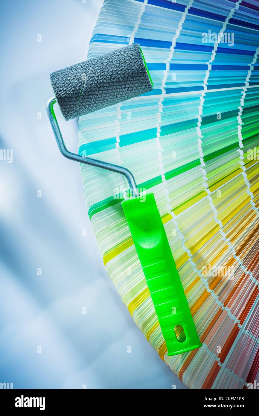 Color sampler paint roller on white surface Stock Photo - Alamy