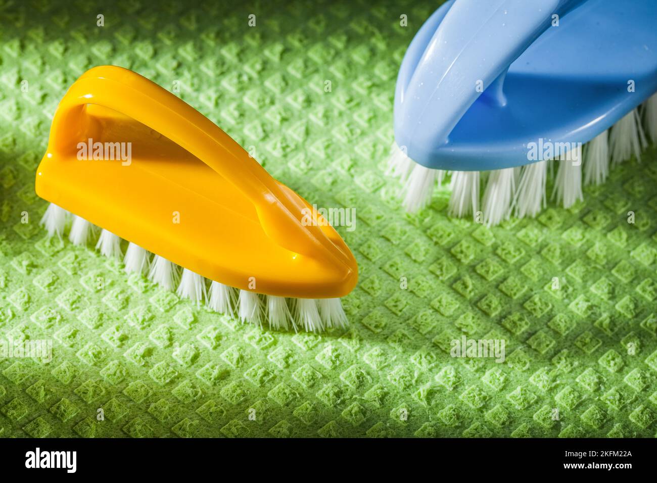 Composition of new plastic brushes on green washcloth. Stock Photo
