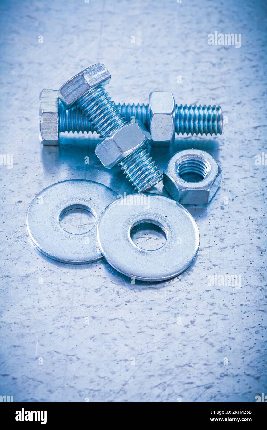Composition of screwbolts screw nuts and bolt washers on metallic background construction