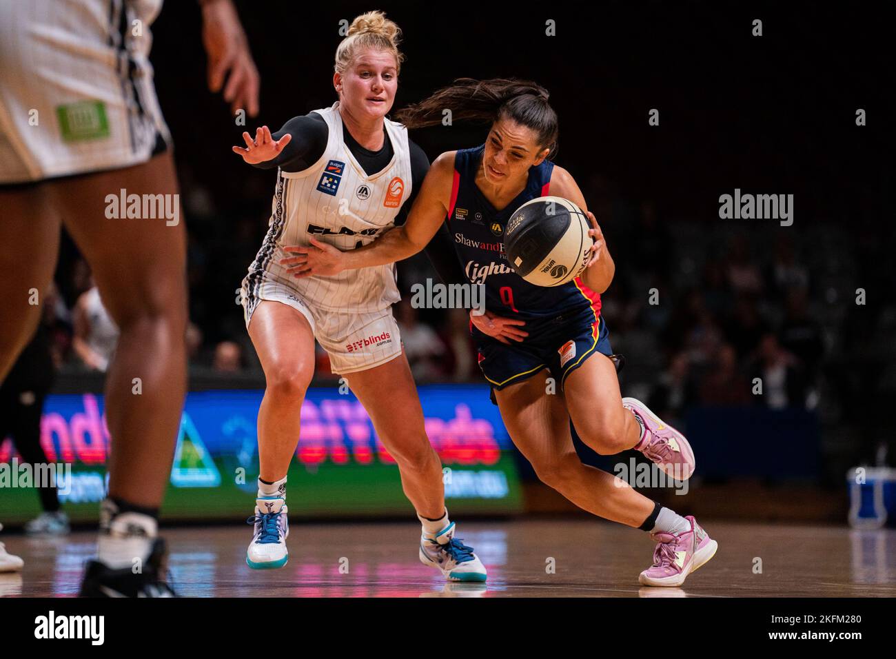 Adelaide, South Australia, November 19th 2022: Abby Cubillo (9 Adelaide Lightning) drives to the basket defended by Shyla Heal (4 Sydney Flames) during the Cygnett WNBL game between Adelaide Lightning and Sydney Flames at Adelaide 36ers Arena in Adelaide, Australia.  (Noe Llamas/SPP) Stock Photo
