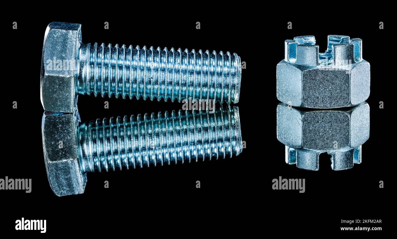 Construction crown nuts bolts on black background horizontal view. Stock Photo