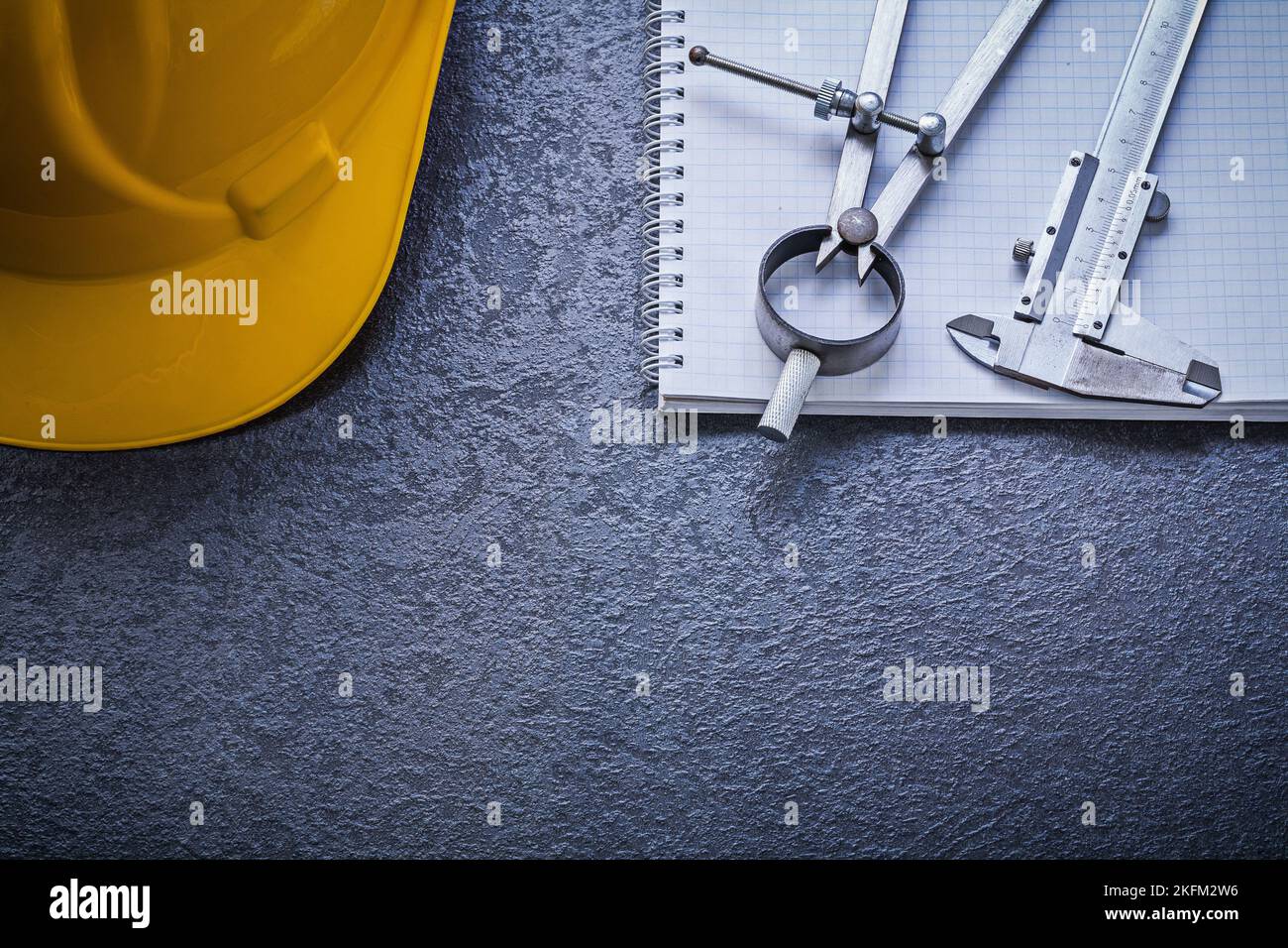 Copybook hard hat divider vernier scale construction concept. Stock Photo
